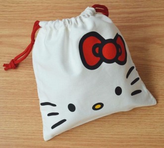 Tas Serut Hello Kitty Putih Motif Wajah HK Souvenir Perhiasan - 027